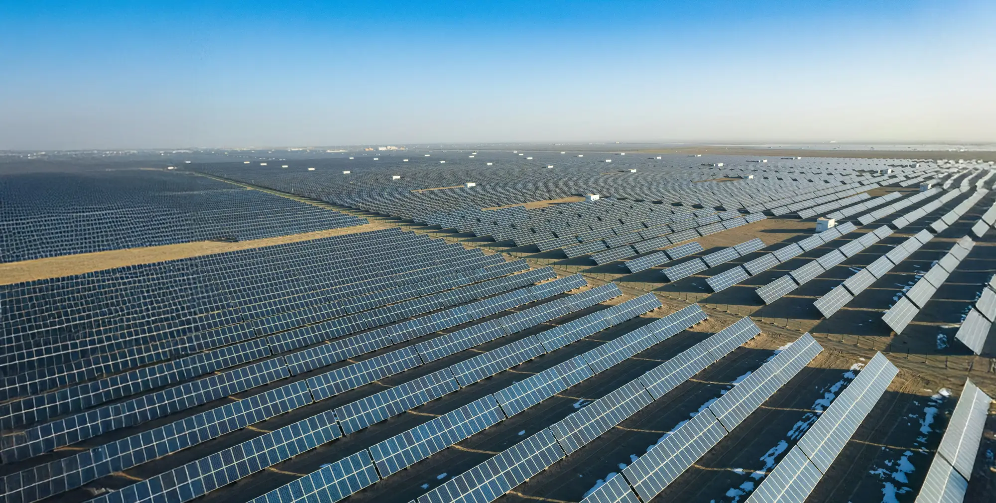 Installation of Polycrystalline solar panels in a desert solar power plant